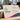 A high-resolution photograph of a stack of premium eco-friendly business cards with visible recycled texture.