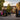 A professional and welcoming school entrance featuring vibrant outdoor banners and a clear sign-in station, shot in high-reso
